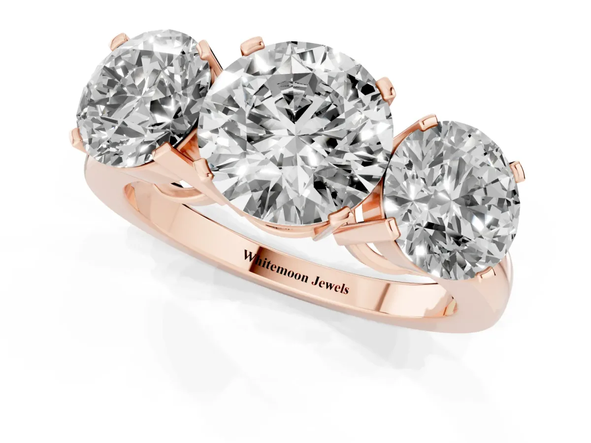 Three-Stone Round Cut Cut Diamond Ring with Channel Set Band and Four-Prong Setting Rose gold