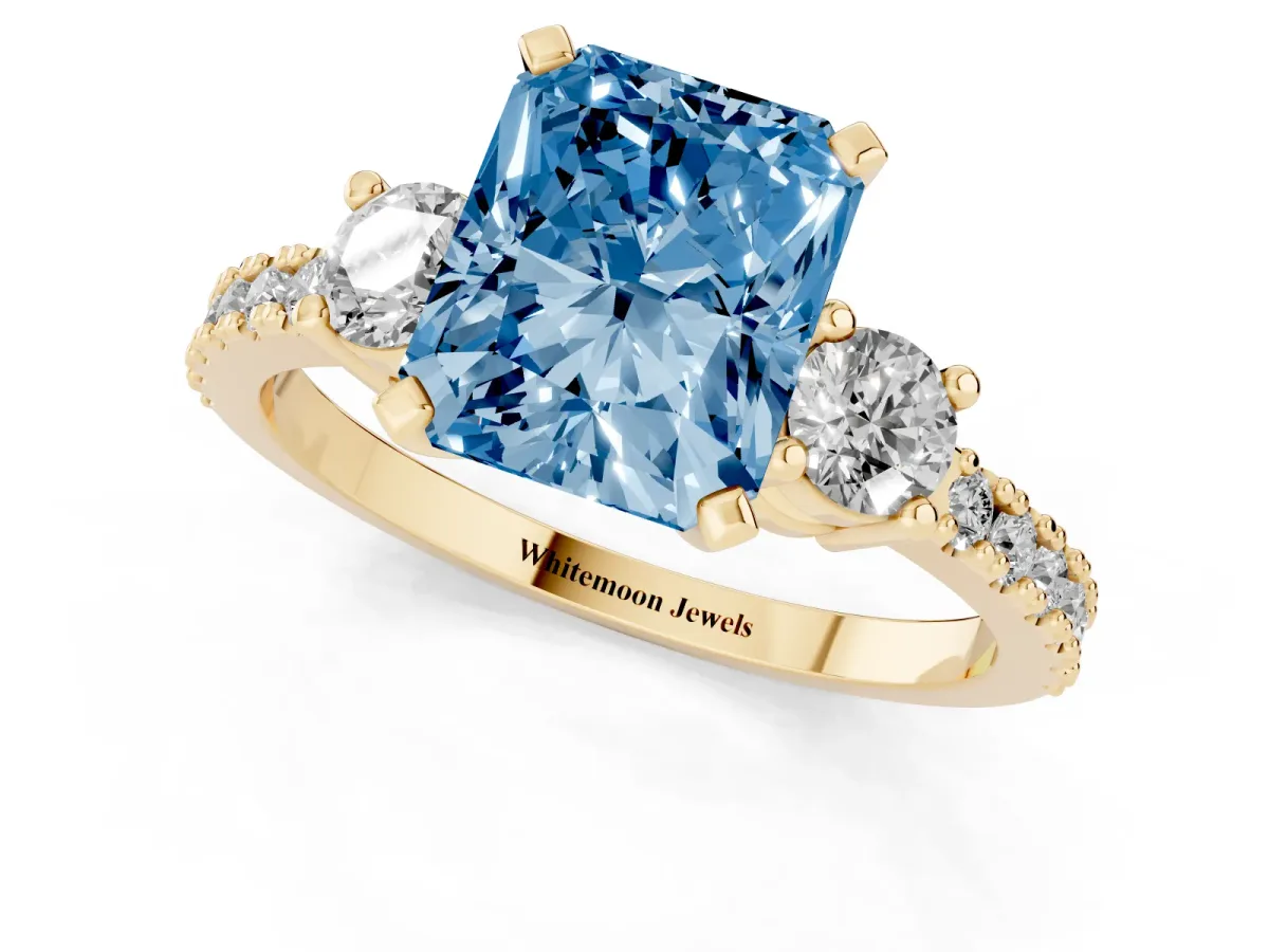 Fancy Blue Radiant Cut Three-Stone Diamond Pavé Band with Prong Setting Yellow gold