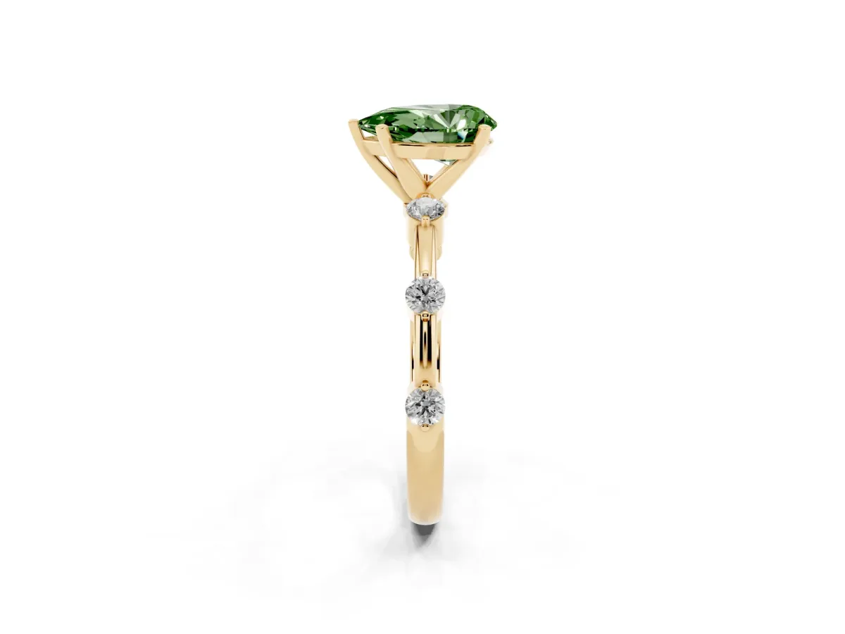 Fancy Green Pear Cut Solitaire Diamond Ring with Bezel Set Side Stones and Prong Setting Yellow gold