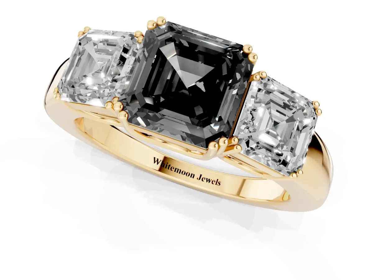 Fancy Black Three-Stone Asscher Cut Cut Diamond Ring with Channel Set Band and Four-Prong Setting Yellow gold