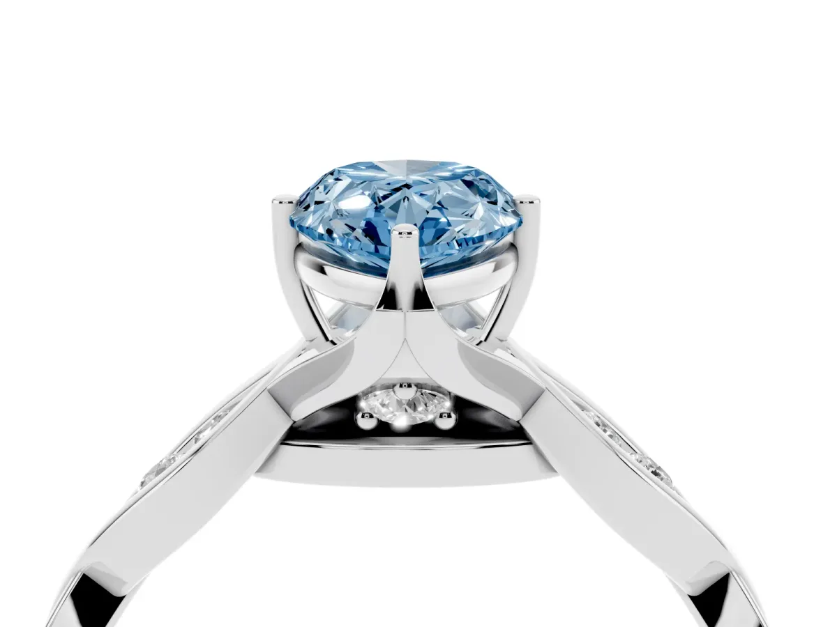Fancy Blue Pear Cut Solitaire Twist Band with Leaf Prong Setting Silver
