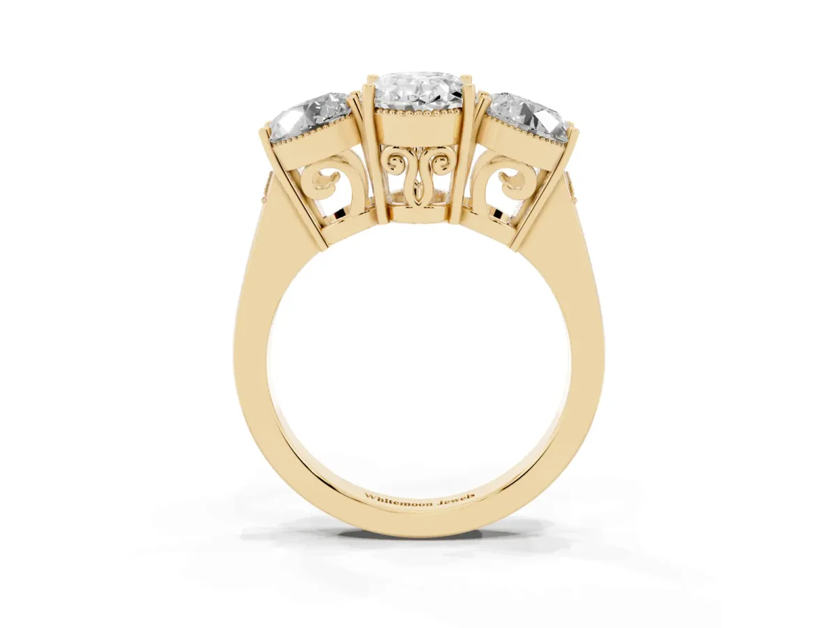 Three-Stone Oval Cut Diamond Engagement Ring with Prong Setting on a Classic Band Yellow gold