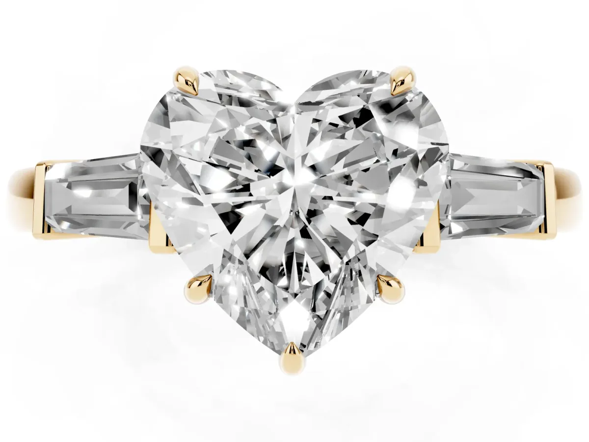 Heart Cut Diamond Three-Stone Ring with Tapered Baguette Side Stones and Prong Setting Yellow gold
