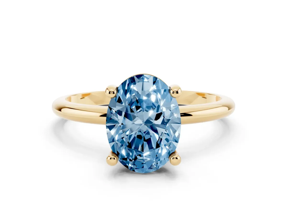 Fancy Blue Oval Cut Solitaire Diamond Ring with 4-Prong Setting on a Classic Band Yellow gold