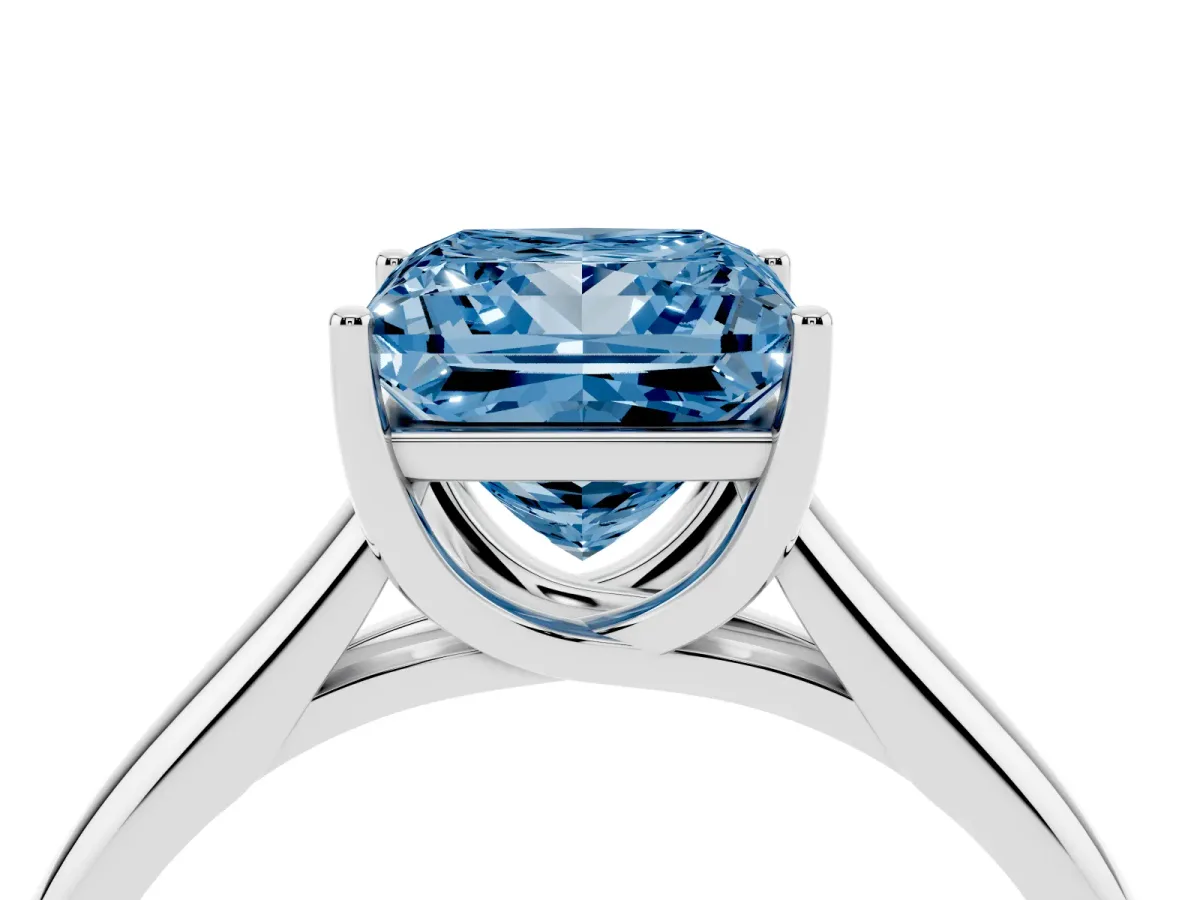 Fancy Blue Princess Cut Solitaire Engagement Ring with Tapered Band and Four-Prong Setting Silver