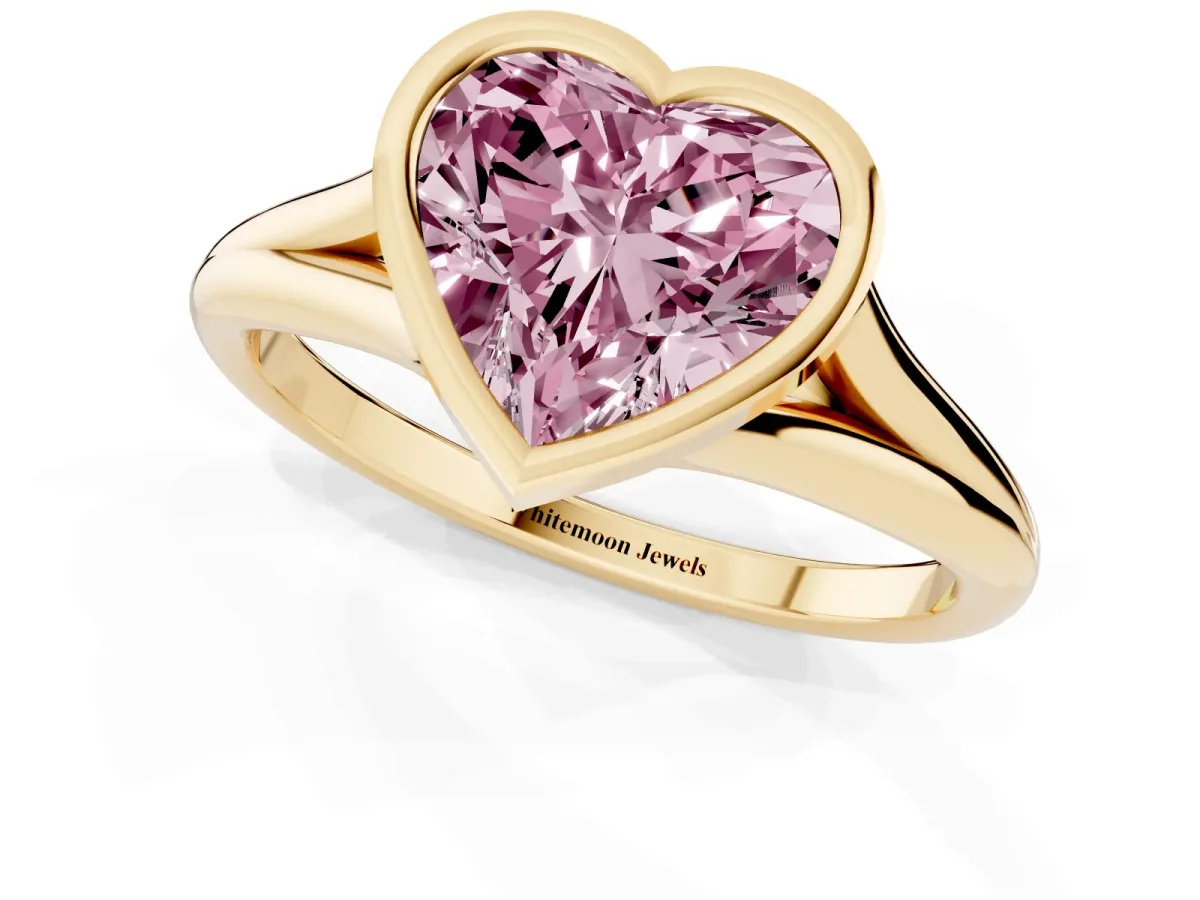 Fancy Pink Bezel Set Heart Cut Cut Solitaire Ring with Tapered Band Yellow gold