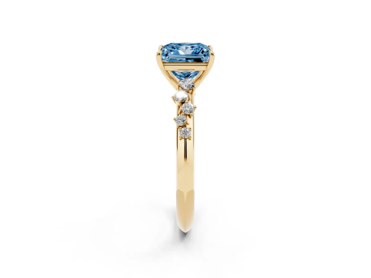 Fancy Blue Princess Cut Diamond Cluster Side Stone Solitaire Ring with Prong Setting Yellow gold
