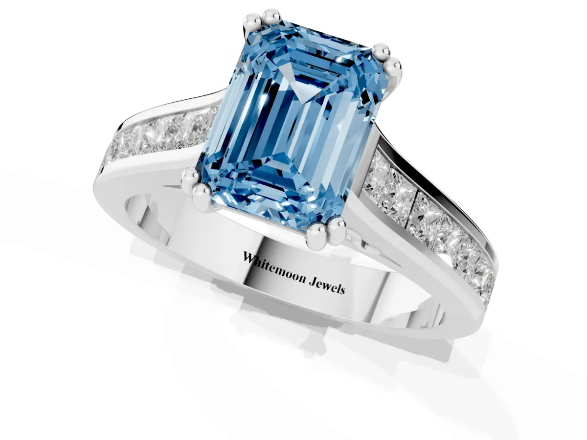 Fancy Blue Emerald Cut Cut Channel Set Solitaire Engagement Ring with Prong Setting Silver