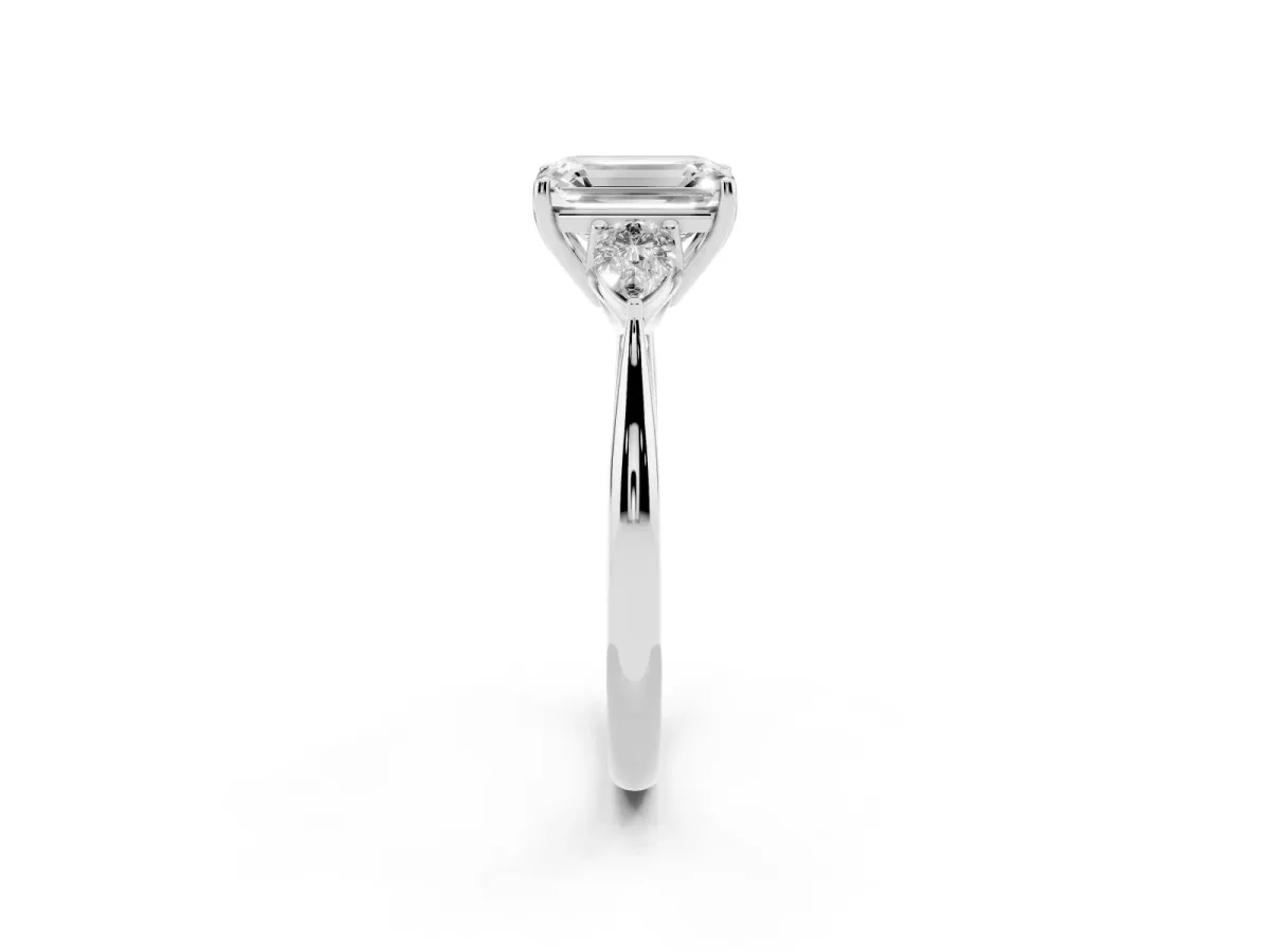 Three-Stone Emerald Cut Diamond Ring with Pear Side Stones in Four-Prong Setting Platinum