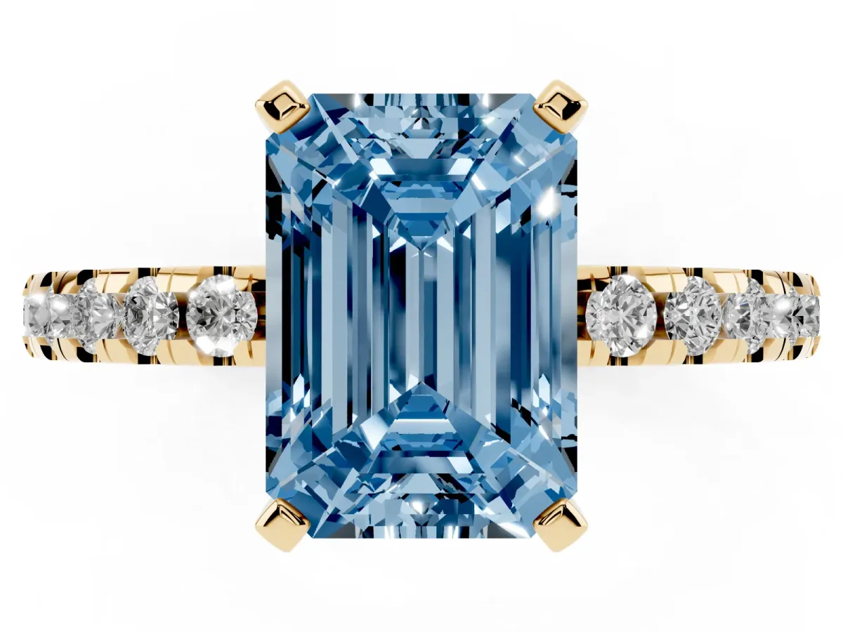 Fancy Blue Emerald Cut Diamond Solitaire Ring with Round Pavé Band and Four-Prong Setting Yellow gold