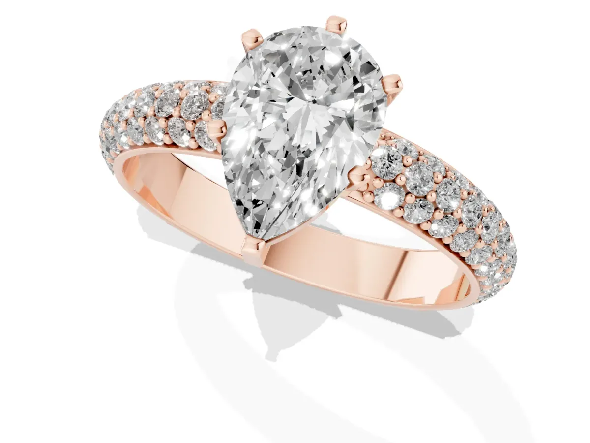 Pear Cut Diamond Solitaire Ring with Prong Setting and Pavé Band Rose gold