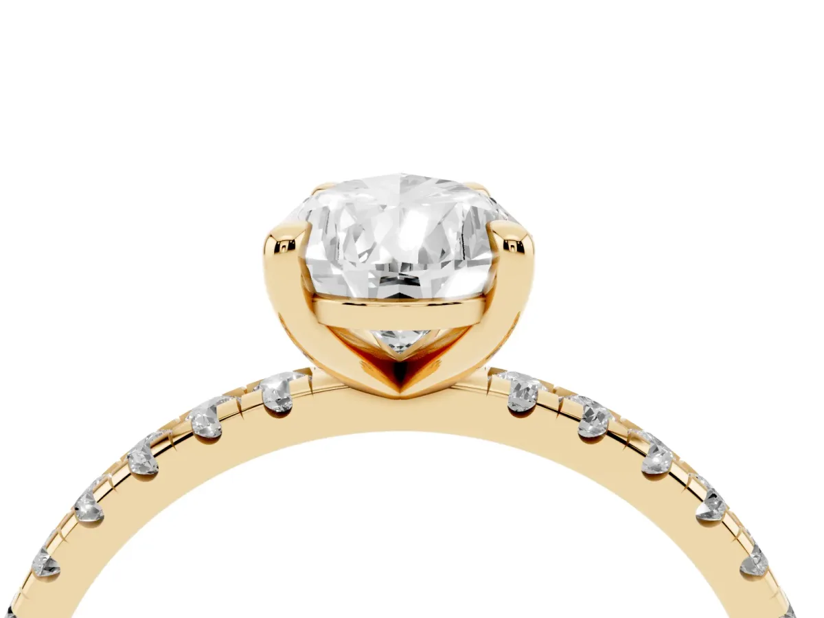 Pear Cut Diamond Brilliant Solitaire Ring with Pavé Band and Four-Prong Setting Yellow gold