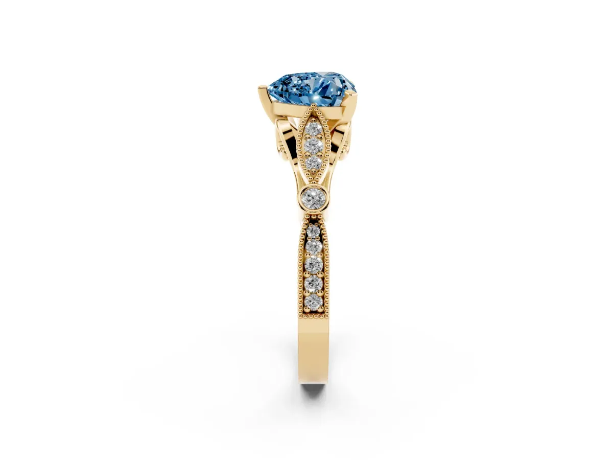 Fancy Blue Heart Cut Cut Diamond with Milgrain Marquise and Bezel Accents on a Solitaire Band with Prong Setting Yellow gold