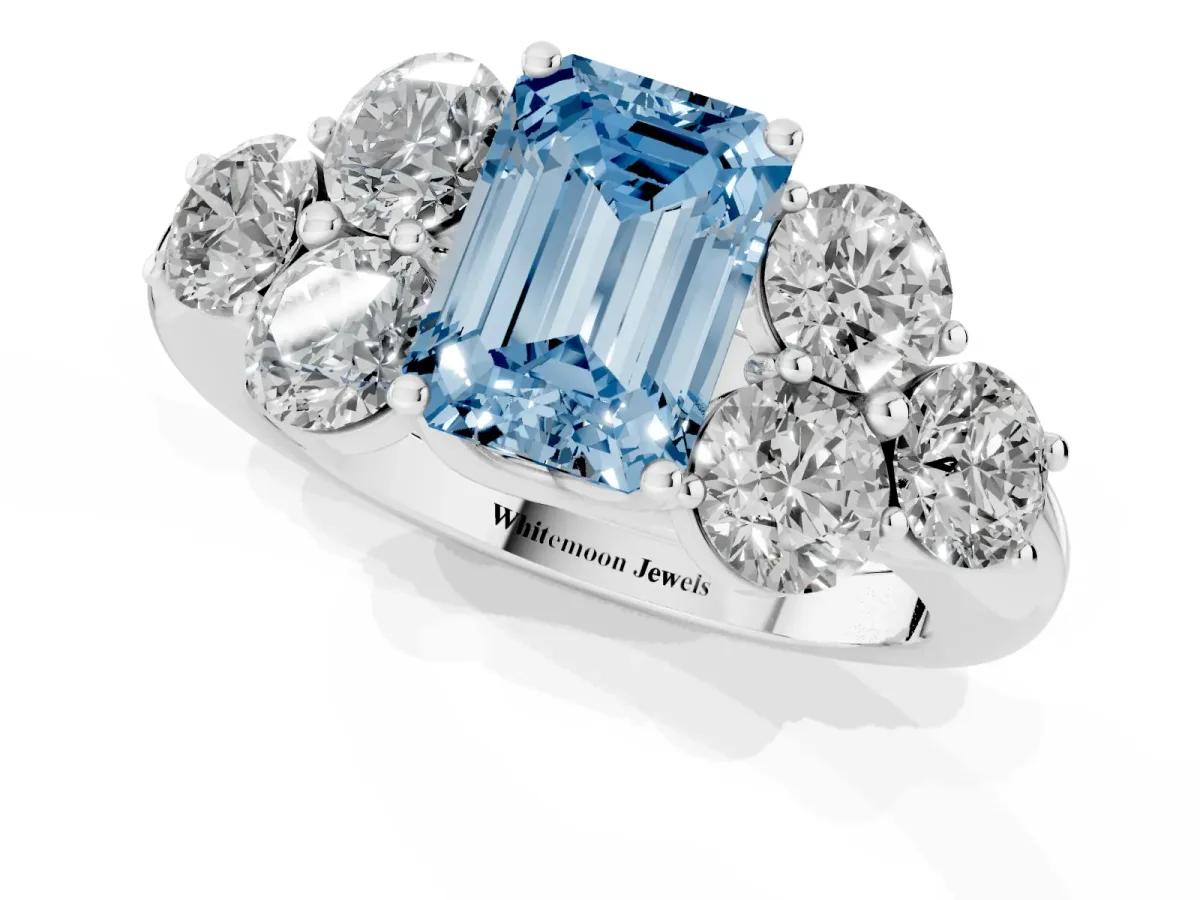 Fancy Blue Emerald Cut Cut Diamond Cluster Ring with Round Accent Stones and Prong Setting on a Classic Band White gold