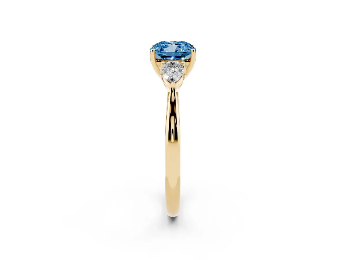 Fancy Blue Cushion Cut Diamond Three-Stone Ring with Pear Side Stones and Prong Setting Yellow gold