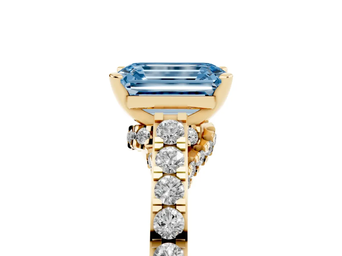 Fancy Blue Emerald Cut Diamond Solitaire Ring with Crossover Gallery and Round Pavé Band Yellow gold