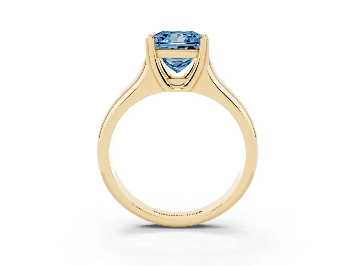 Fancy Blue Princess Cut Diamond Solitaire Ring with Wide Band and Prong Setting Yellow gold