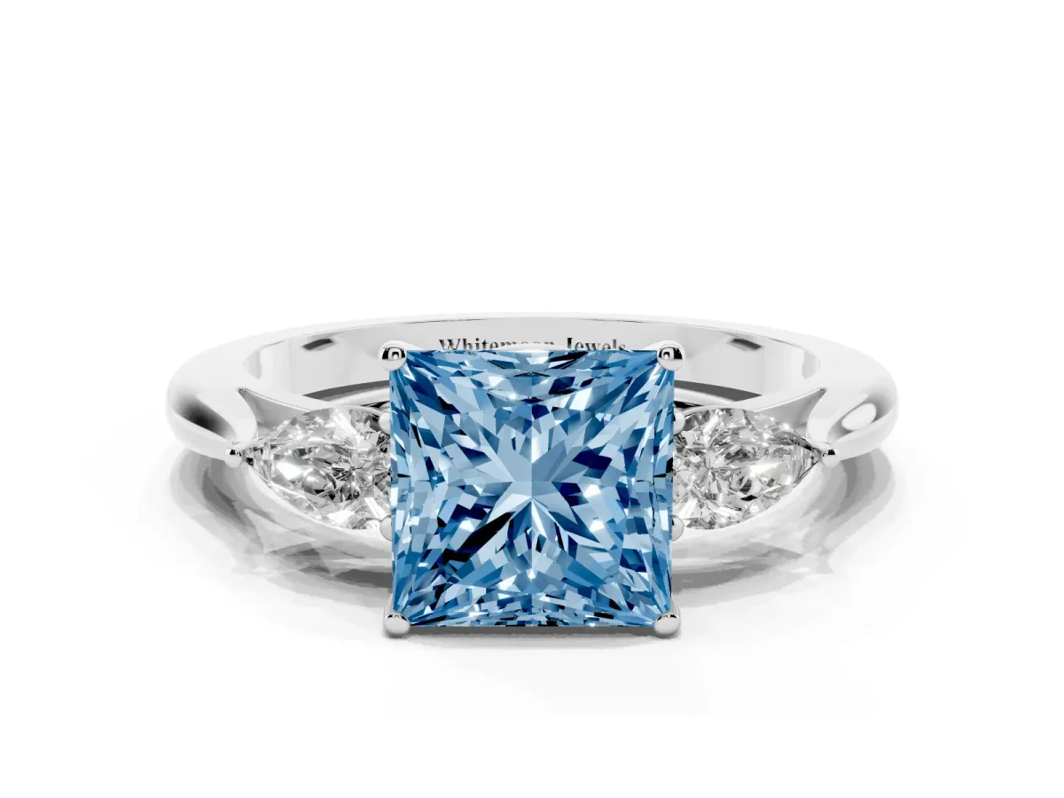 Fancy Blue Three-Stone Princess Cut Brilliant Diamond Solitaire Ring with Tapered Band and Four-Prong Setting White gold