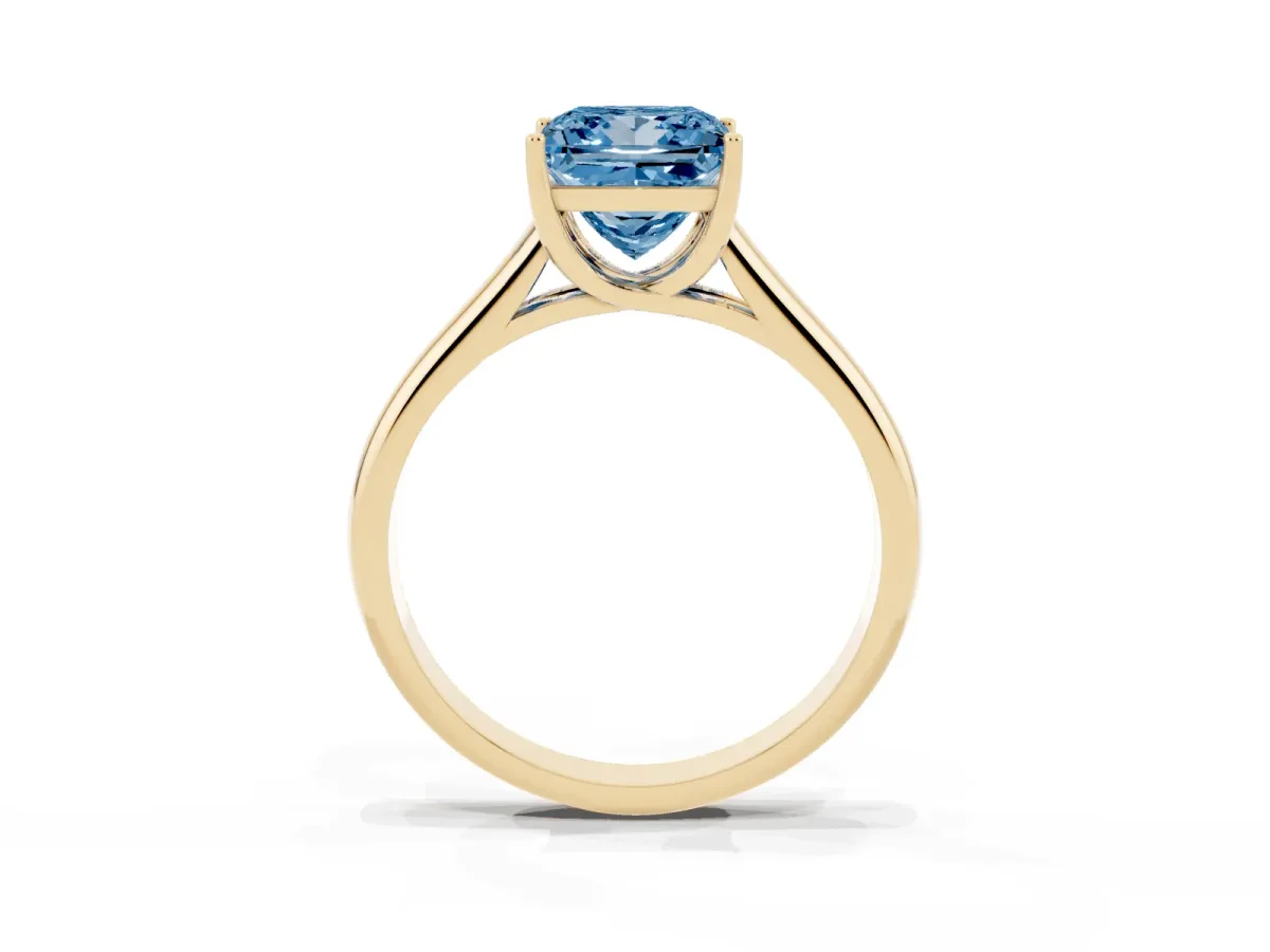 Fancy Blue Princess Cut Solitaire Engagement Ring with Tapered Band and Four-Prong Setting Yellow gold