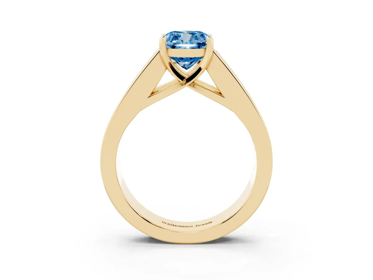 Fancy Blue Cushion Cut Cut Channel Set Solitaire Ring with Four-Prong Setting Yellow gold