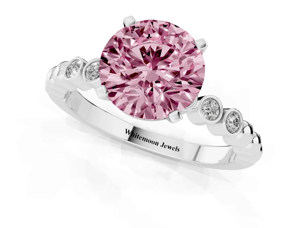 Fancy Pink Round Cut Solitaire Bezel Accent Diamond Engagement Ring with Beaded Band and Four-Prong Setting Platinum