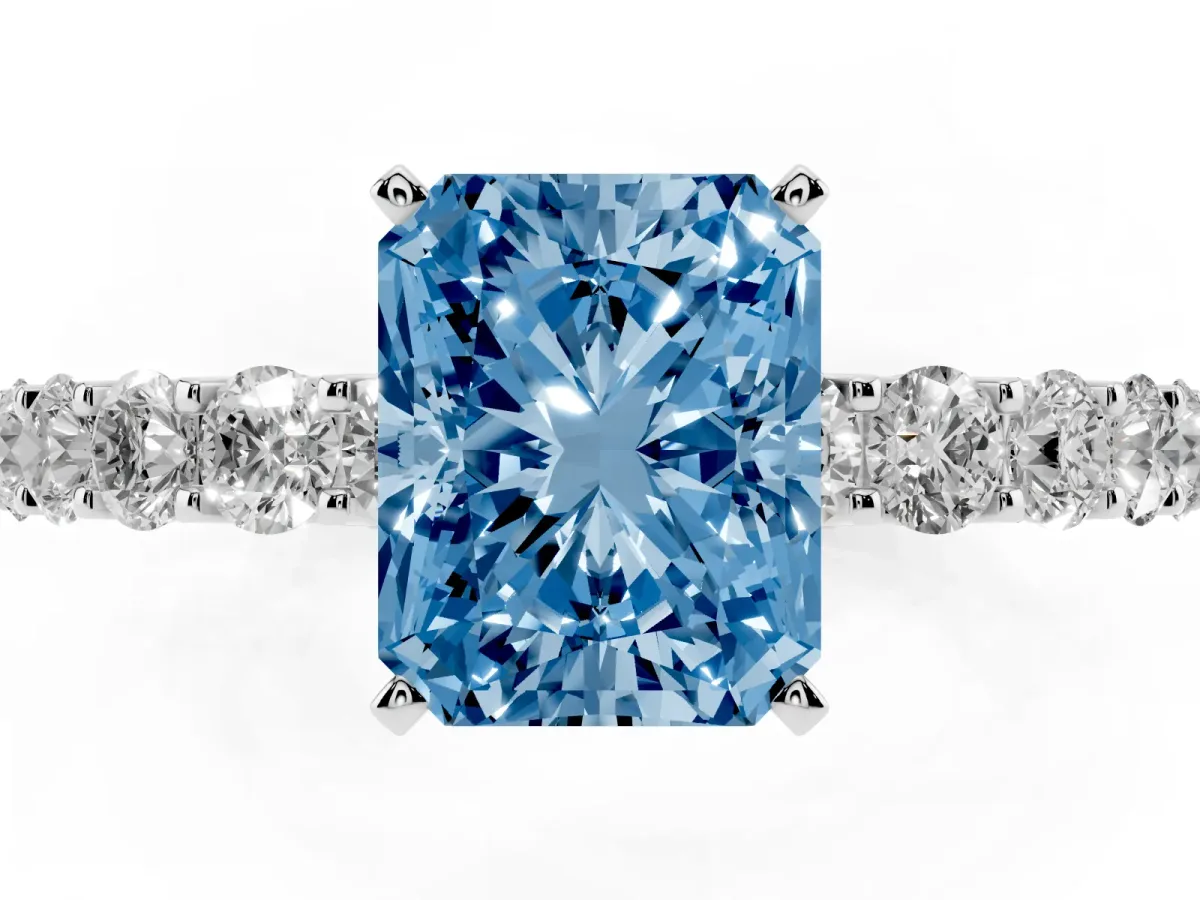 Fancy Blue Radiant Cut Diamond Solitaire Ring with Shared Prong Pavé Band and Four-Prong Setting Silver