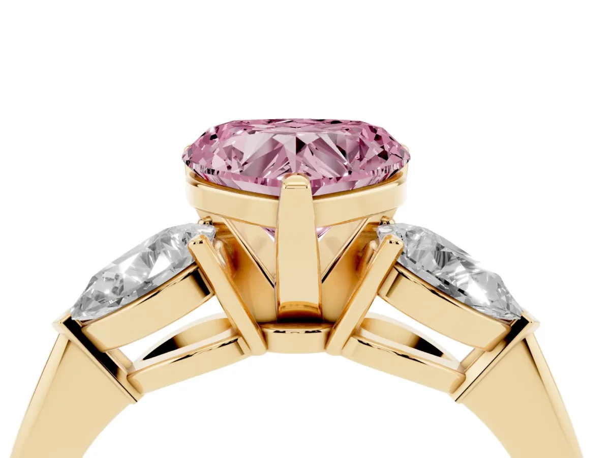Fancy Pink Three-Stone Heart Cut Diamond Ring with Pear Side Stones and Four-Prong Setting Yellow gold