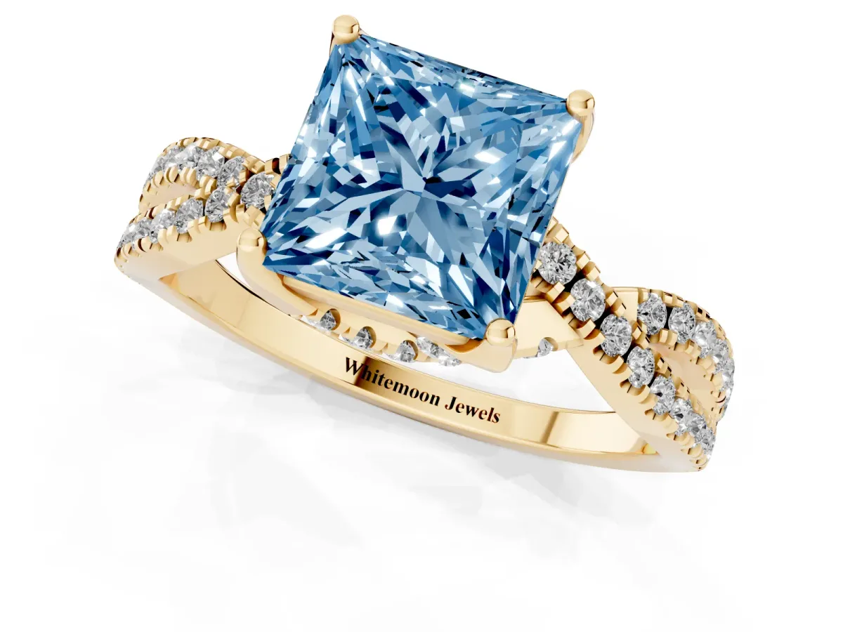 Fancy Blue Princess Cut Solitaire Twist Pave Diamond Engagement Ring with Prong Setting Yellow gold