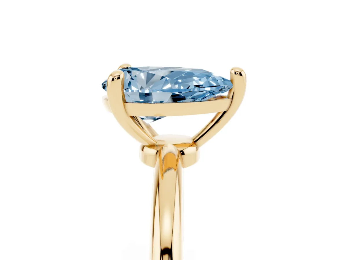 Fancy Blue Pear Cut Solitaire Diamond Ring with 4-Prong Setting on a Classic Band Yellow gold