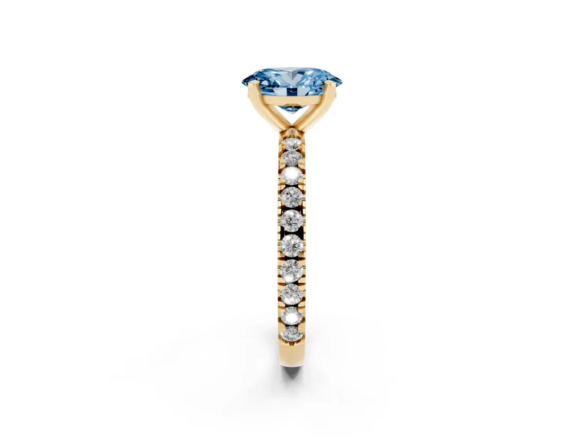 Fancy Blue Oval Cut Diamond Pavé Band Solitaire with Four-Prong Setting Yellow gold