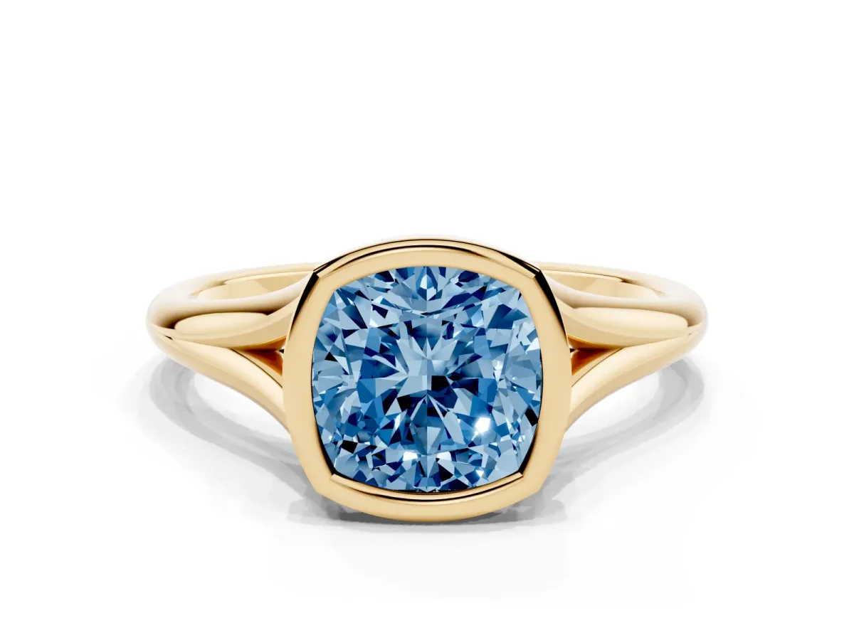 Fancy Blue Bezel Set Cushion Cut Cut Solitaire Ring with Tapered Band Yellow gold
