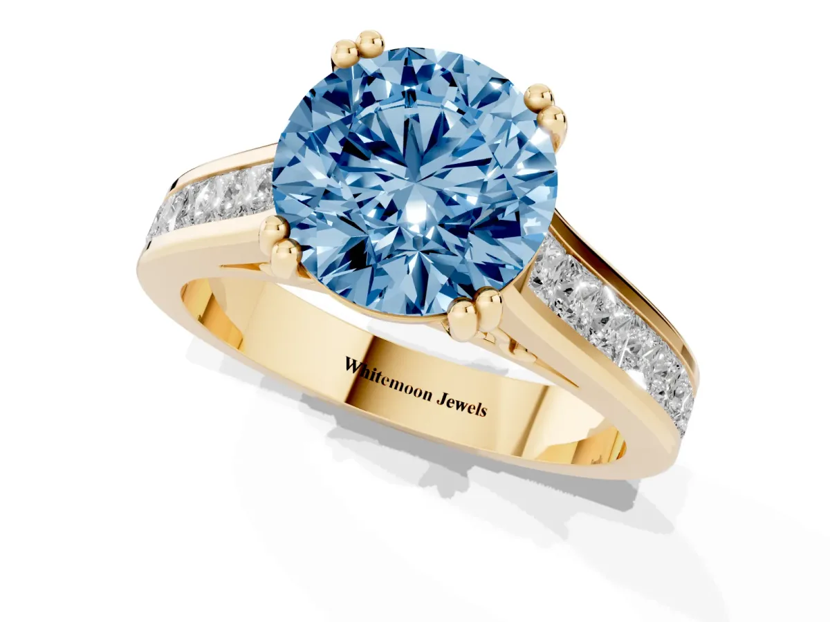 Fancy Blue Round Cut Cut Channel Set Solitaire Engagement Ring with Prong Setting Yellow gold