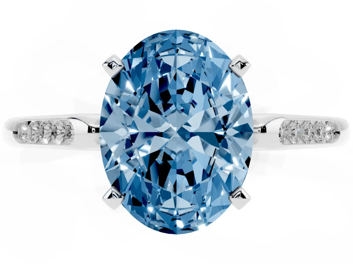 Fancy Blue Oval Cut Diamond Solitaire Ring with Channel Set Round Band and Prong Setting Silver