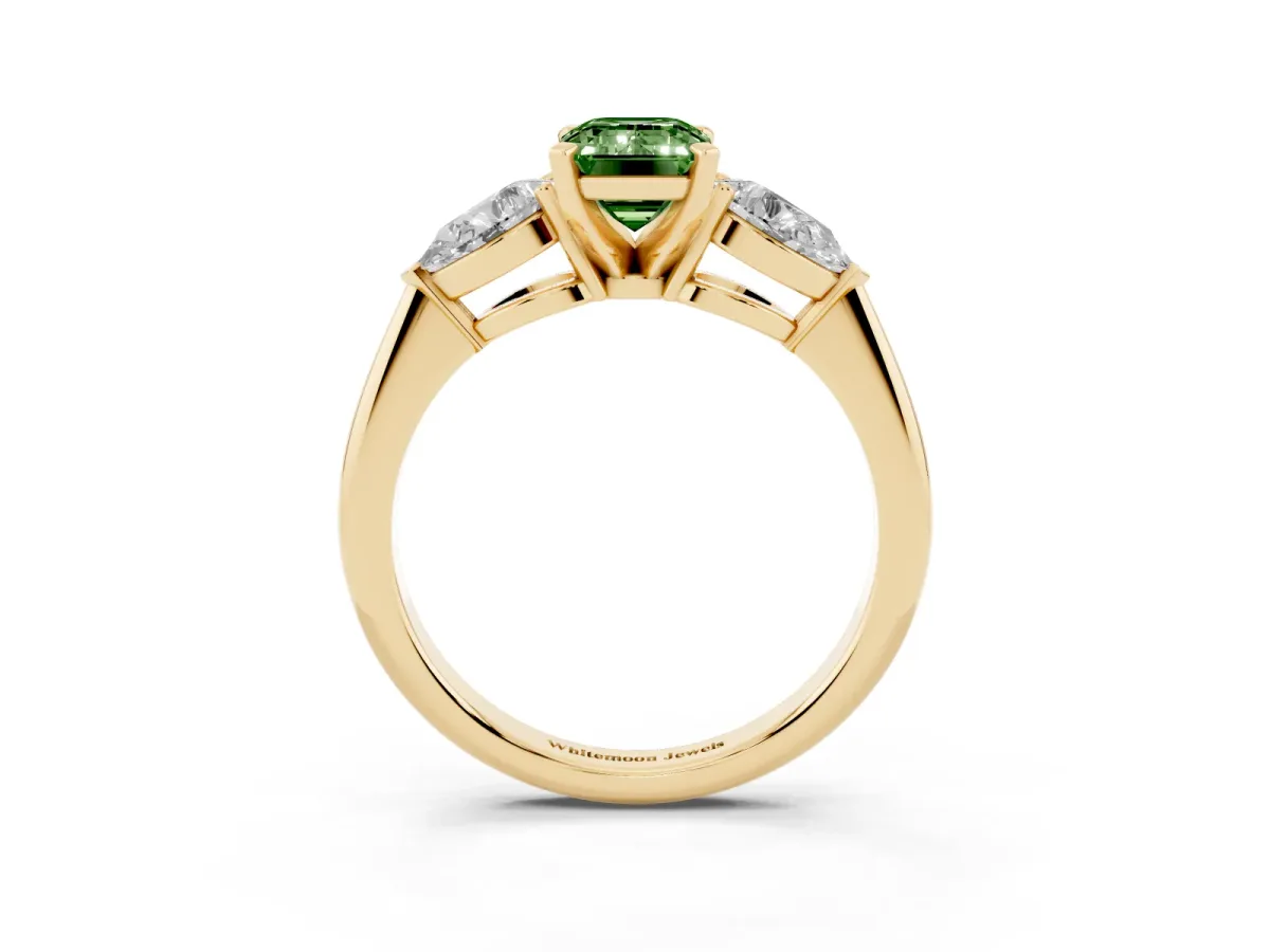 Fancy Green Three-Stone Emerald Cut Diamond Ring with Pear Side Stones and Four-Prong Setting Yellow gold