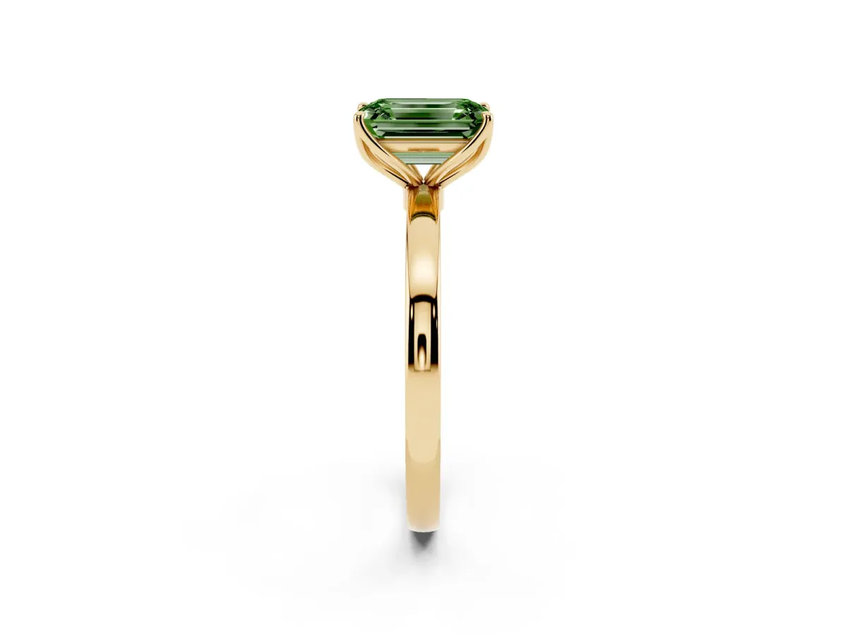 Fancy Green Emerald Cut Diamond Solitaire Ring with Thin Band and Prong Setting Yellow gold