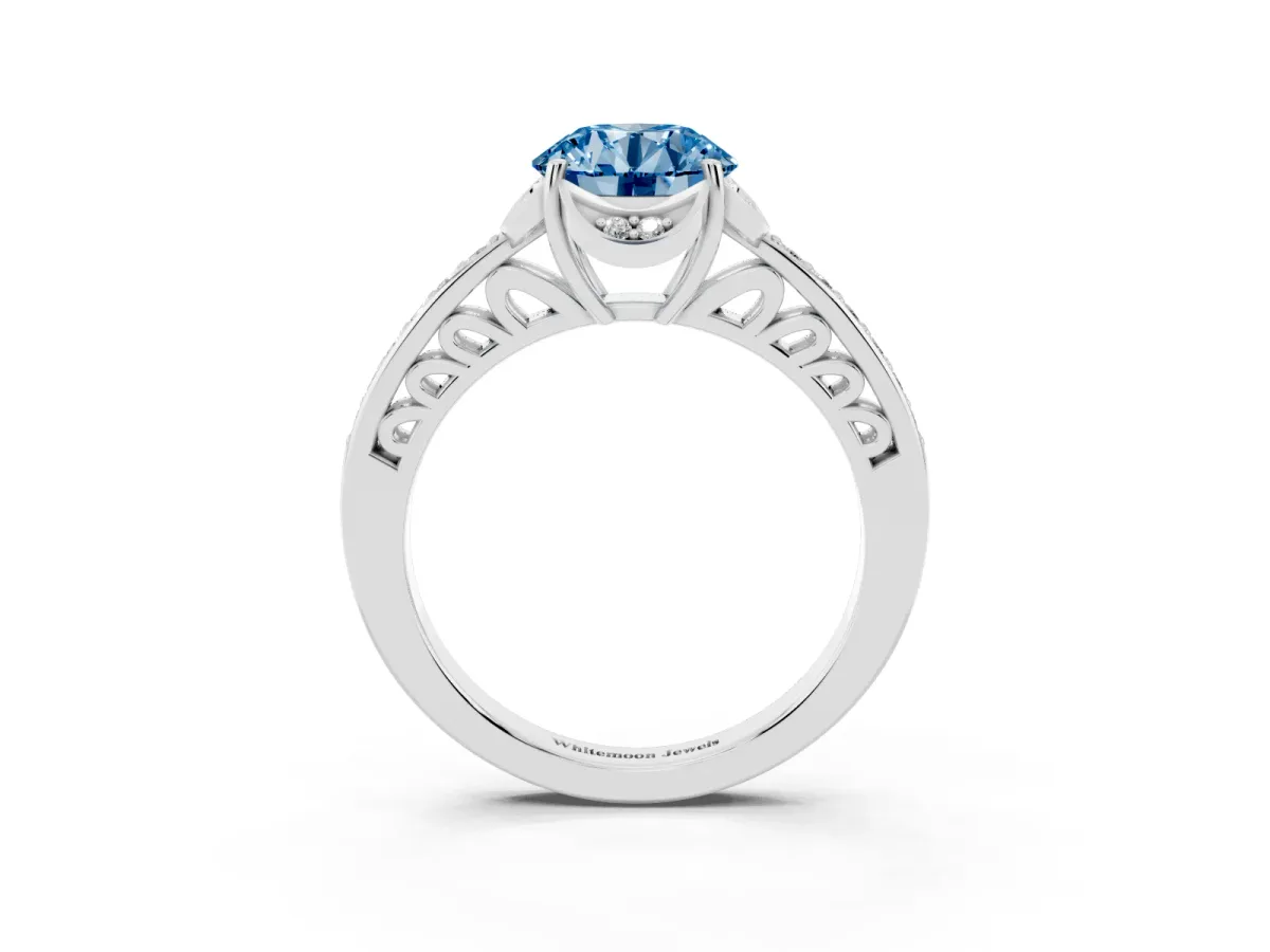 Fancy Blue Round Cut Cut Halo Diamond Ring with Channel Set Band and Four-Prong Setting Silver