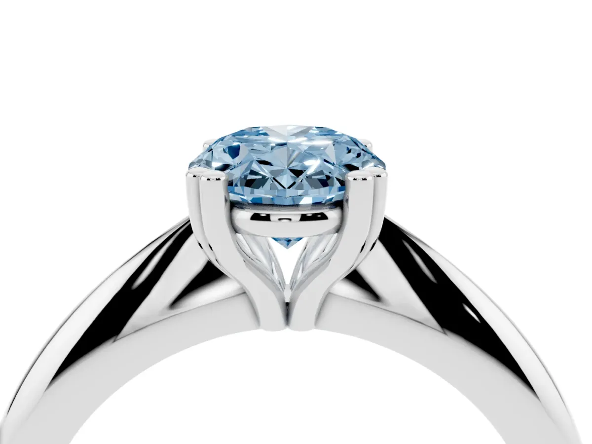 Fancy Blue Oval Cut Cut Solitaire Engagement Ring with Tapered Band and Four-Prong Setting Silver