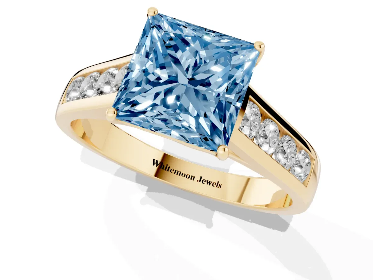 Fancy Blue Princess Cut Brilliant Channel-Set Solitaire Ring with Four-Prong Setting Yellow gold