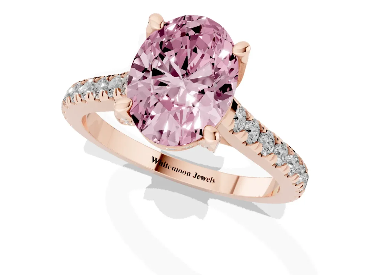 Fancy Pink Oval Cut Brilliant Diamond Solitaire with Pavé Band and Four-Prong Setting Rose gold