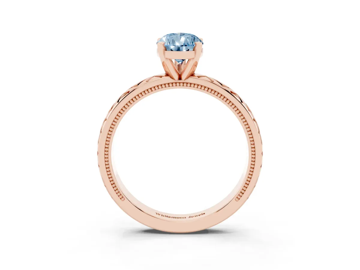 Fancy Blue Pear Cut Solitaire Diamond Ring with Milgrain and Black Enamel X Pattern Band Rose gold