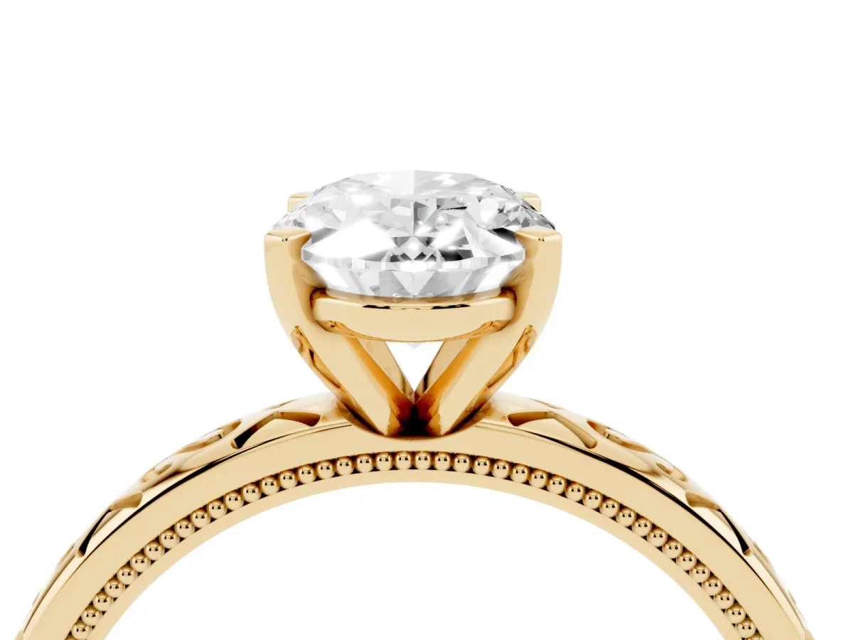 Oval Cut Solitaire Engagement Ring with Scrollwork Band and Four-Prong Setting Yellow gold