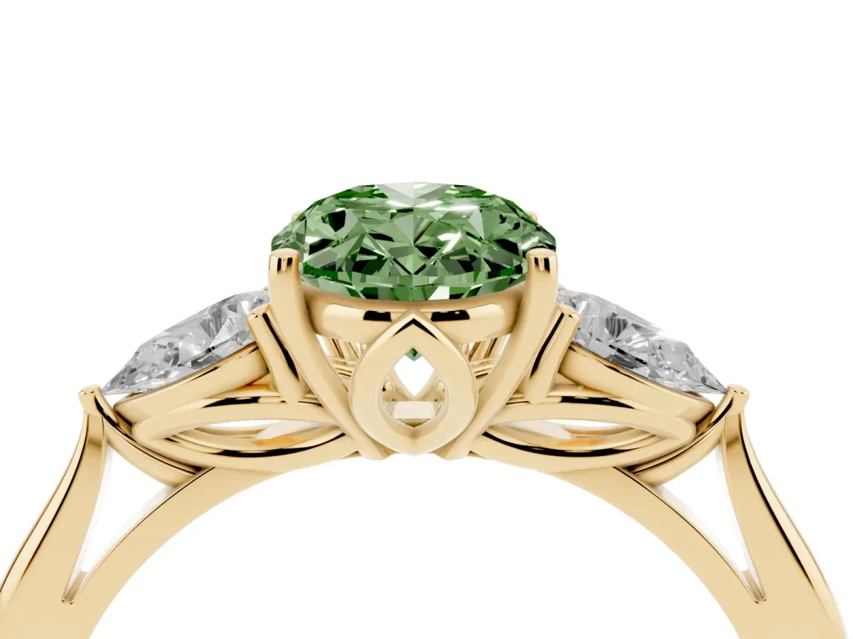 Fancy Green Three-Stone Oval Cut Diamond Ring with Pear Side Stones in Four-Prong Setting Yellow gold