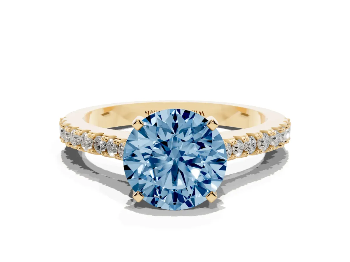 Fancy Blue Round Cut Cut Solitaire Diamond Engagement Ring with Pave Band and Four-Prong Setting Yellow gold