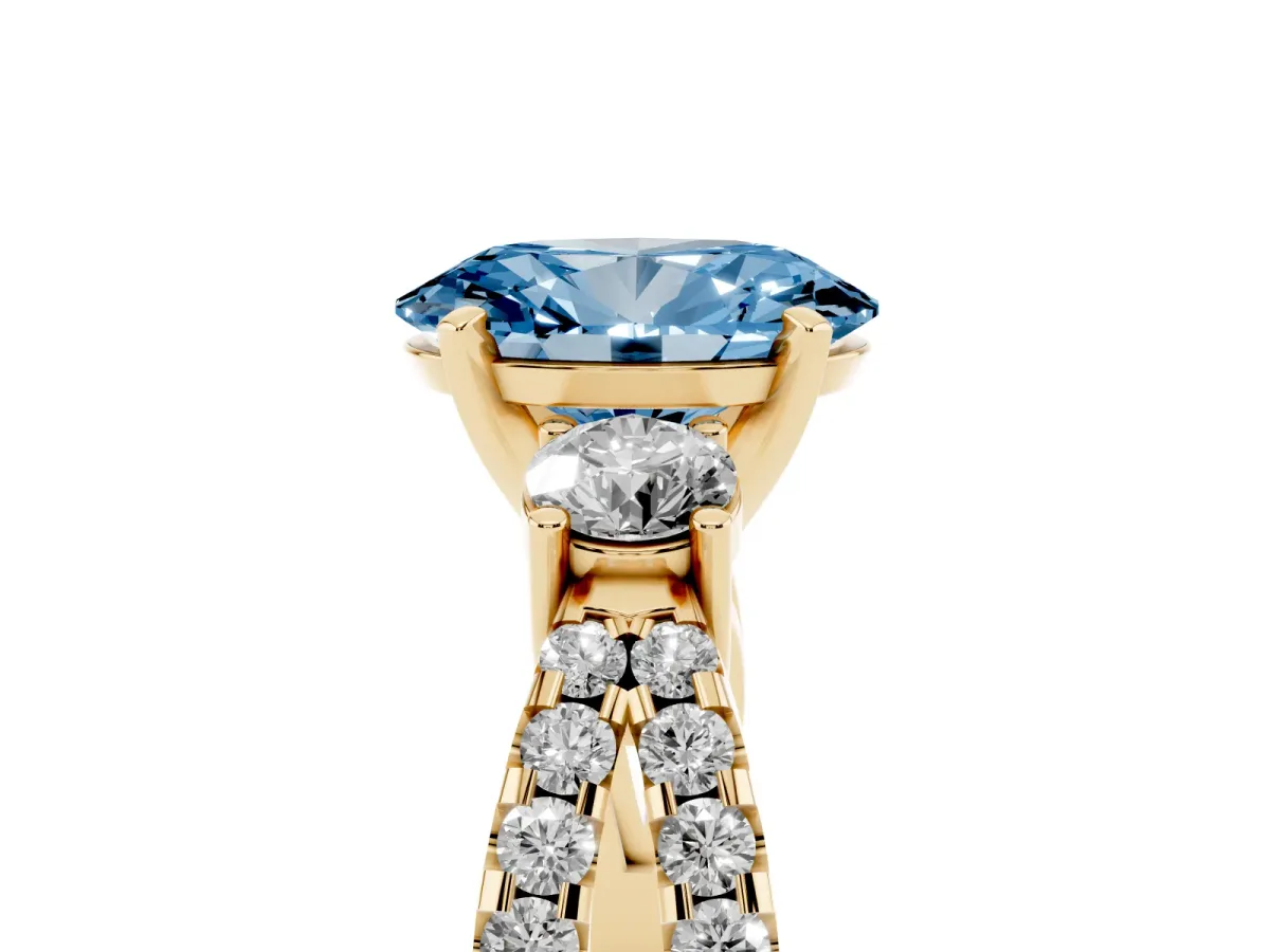 Fancy Blue Oval Cut Diamond Three-Stone Ring with Pavé Split Shank and Four-Prong Setting Yellow gold