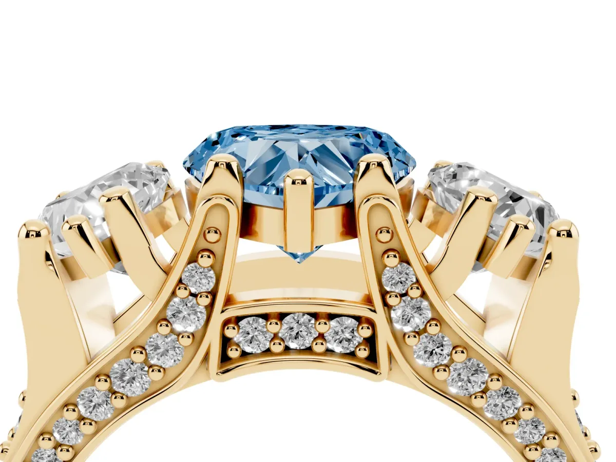 Fancy Blue Heart Cut Diamond Three-Stone Ring with Channel Set Band and Four-Prong Setting Yellow gold