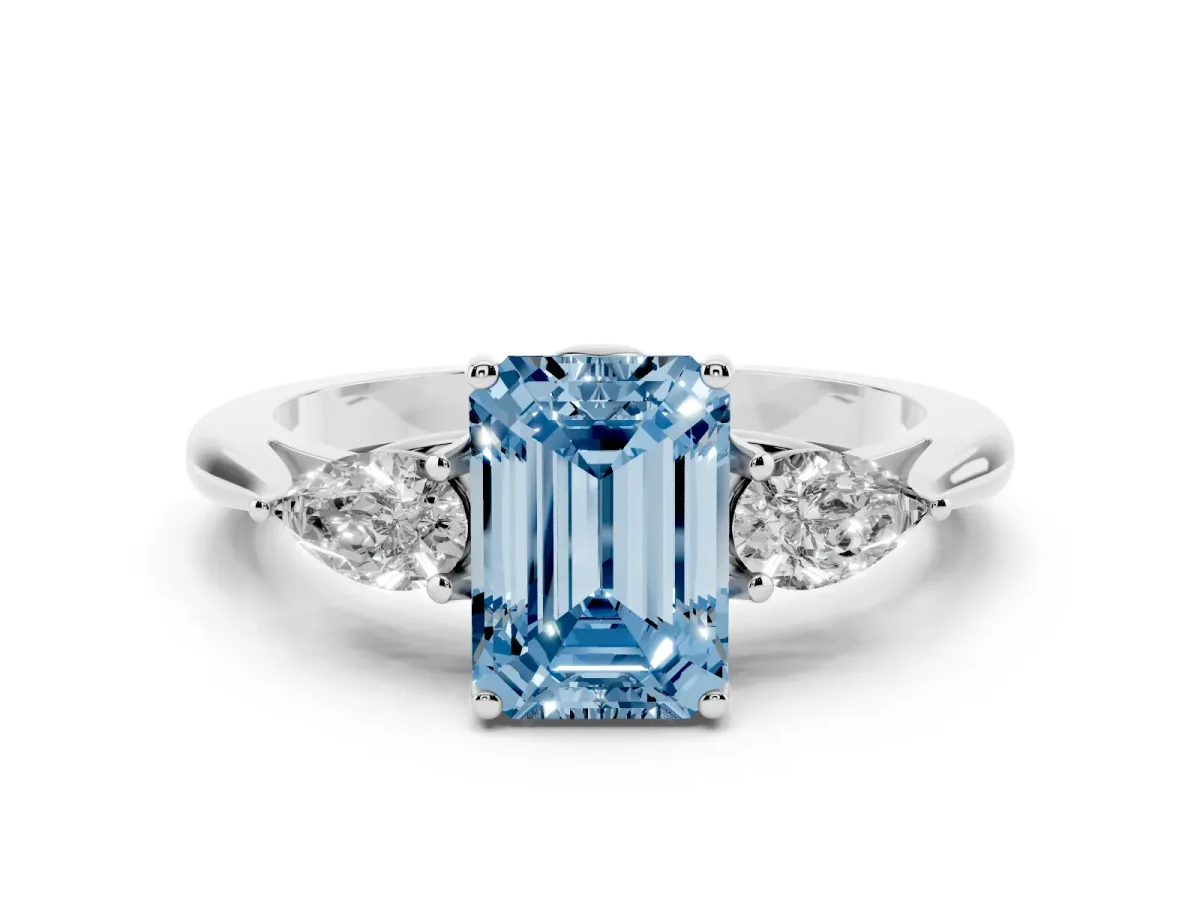 Fancy Blue Three-Stone Emerald Cut Diamond Ring with Pear Side Stones in Four-Prong Setting Silver
