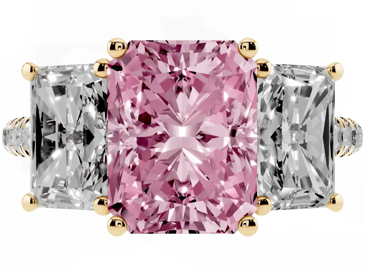 Fancy Pink Three-Stone Radiant Cut Diamond Ring with Round Pavé Band and Prong Setting Yellow gold