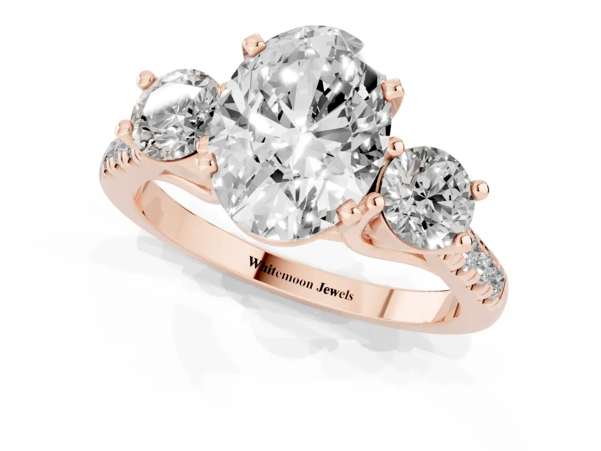 Three-Stone Oval Cut Diamond Pavé Band with Four-Prong Setting Rose gold