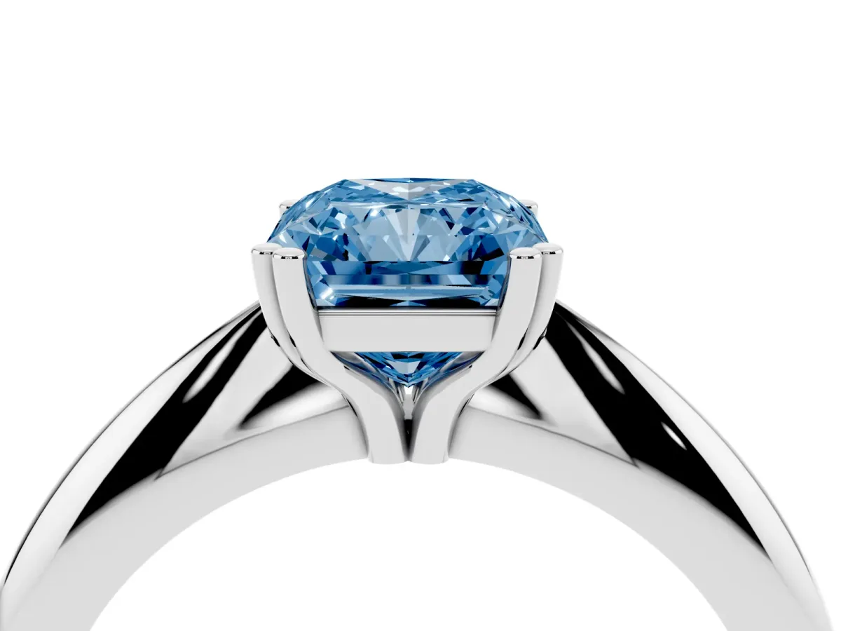 Fancy Blue Radiant Cut Cut Solitaire Engagement Ring with Tapered Band and Four-Prong Setting White gold