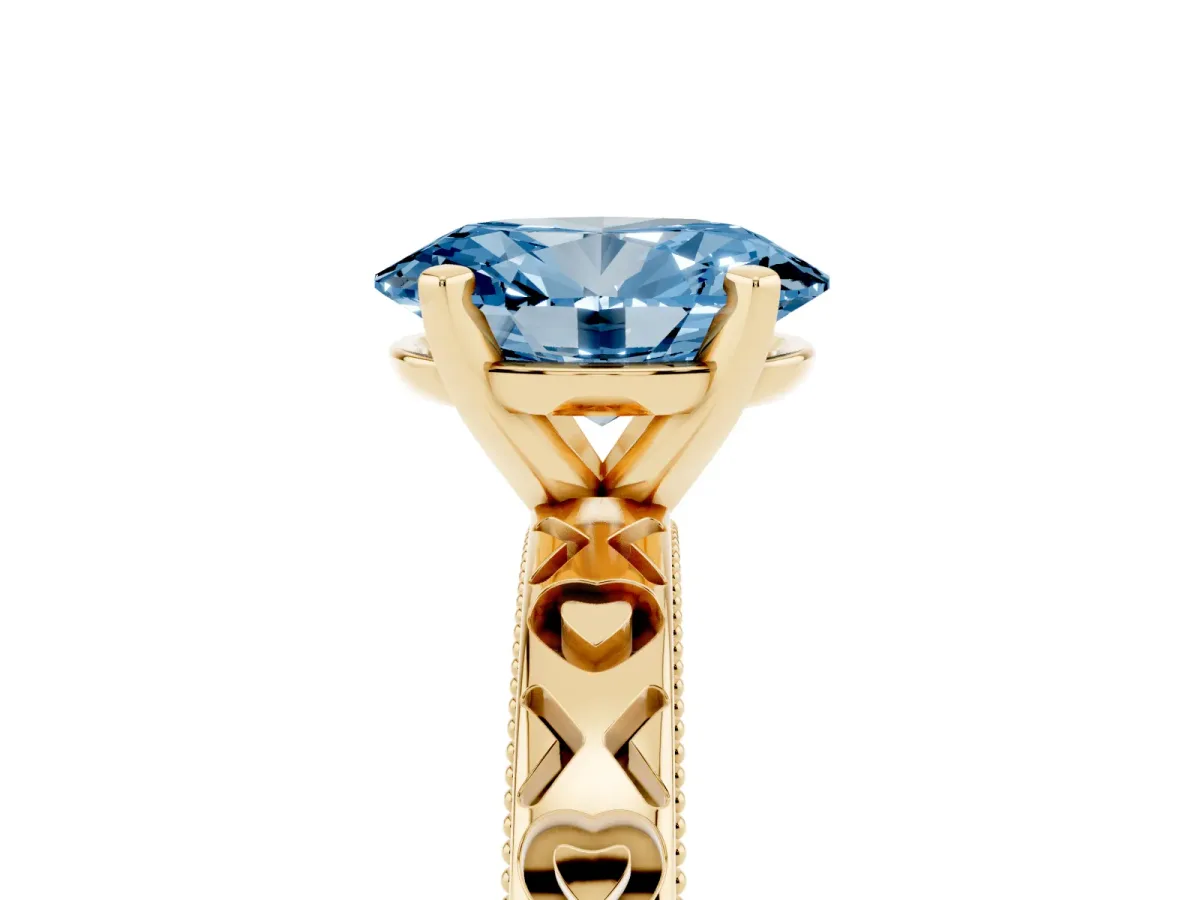 Fancy Blue Oval Cut Solitaire Diamond Engagement Ring with XO Engraved Band and Four-Prong Setting Yellow gold